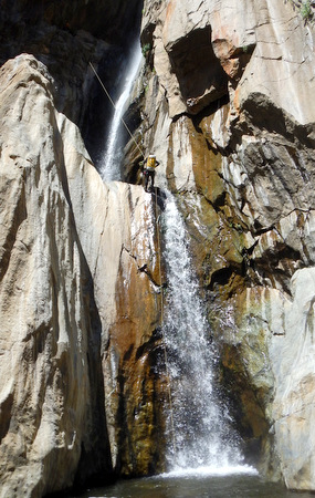 Luca rappeling chained waterfalls (110 ft)